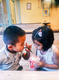 Father and daughter holding ice cream