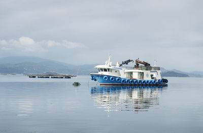 Boat in sea against sky