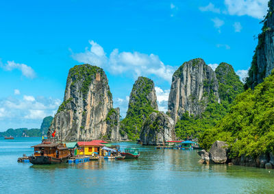 Panoramic view of boats in sea against sky