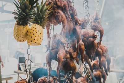 Close-up of roasted chicken for sale in market