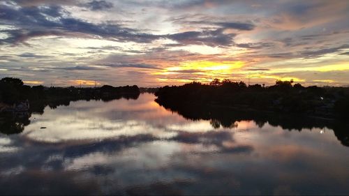 Scenic view of lake against sky during sunset