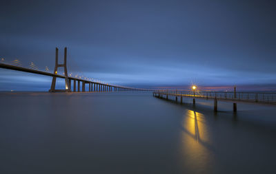 Illuminated suspension bridge at night