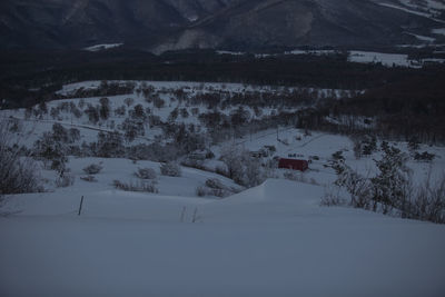 Scenic view of snow covered landscape and mountains