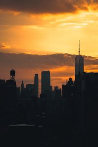 Silhouette of city at sunset