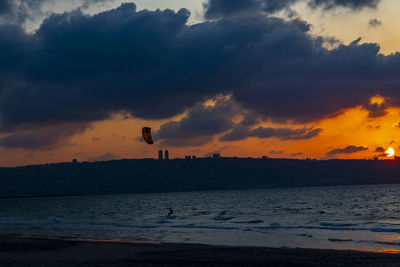 Scenic view of sea against sky at sunset