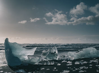 Scenic view of sea against sky during winter