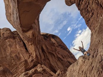 Low angle view of rock formation against sky