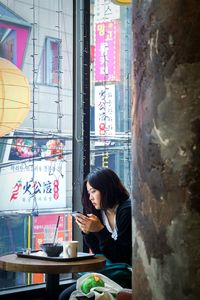 Woman sitting in restaurant