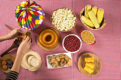 High angle view of hand holding food on table