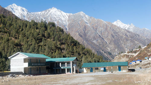 Scenic view of mountains against clear blue sky