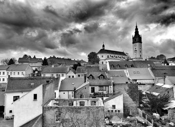 Buildings in town against sky