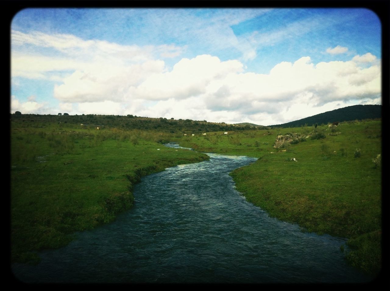 transfer print, sky, water, auto post production filter, cloud - sky, tranquil scene, grass, scenics, tranquility, beauty in nature, nature, landscape, cloud, river, cloudy, stream, waterfront, day, non-urban scene, outdoors