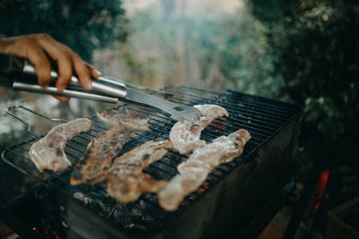 High angle view of meat on barbecue grill