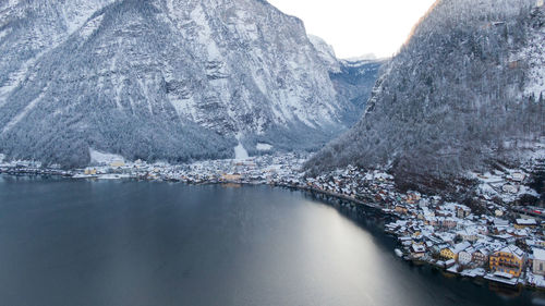 Aerial view of river amidst snowcapped mountains