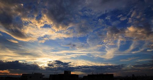 Low angle view of dramatic sky during sunset