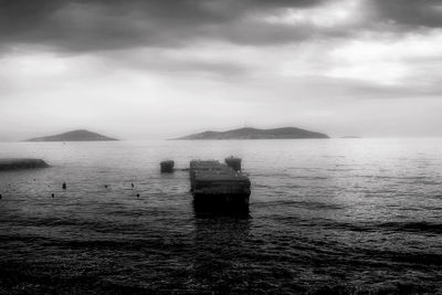 Scenic view of sea against cloudy sky