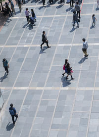 High angle view of people on footpath in city