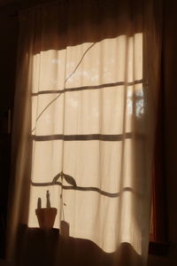 Close-up of curtain on window at home