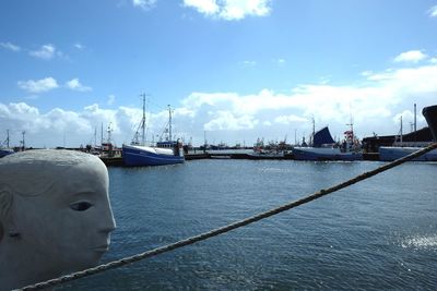 Boats moored at harbor