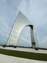 Low angle view of monument against cloudy sky