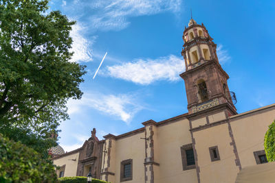 Low angle view of church against blue sky