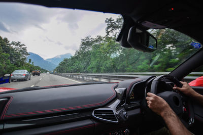 Cropped image of car on road