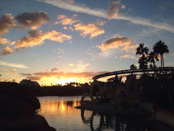 Scenic view of swimming pool against sky during sunset