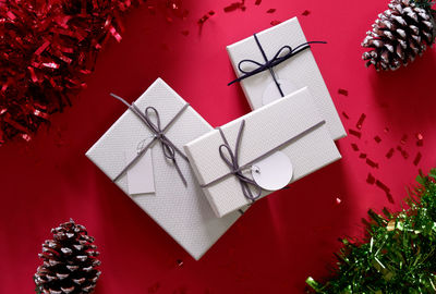High angle view of gifts against red background