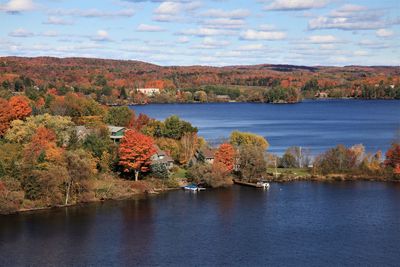 Scenic view of lake against sky during autumn