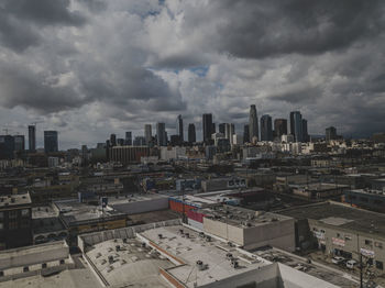 High angle view of buildings in city against sky