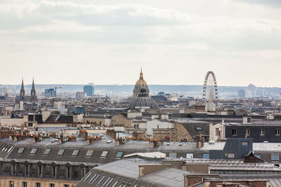 High angle view of buildings in city against sky