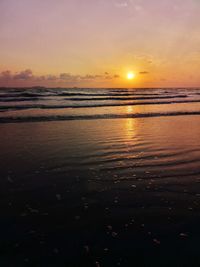 Scenic view of sea against romantic sky at sunset