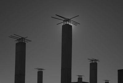 Low angle view of traditional windmill against sky