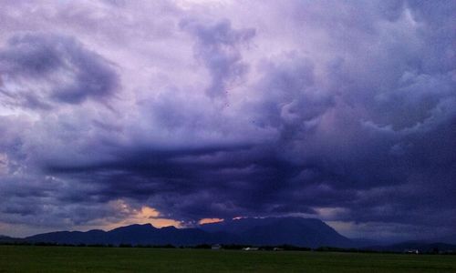 Scenic view of dramatic sky over land