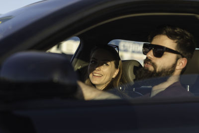 Couple sitting in car