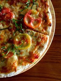 Directly above shot of pizza served on table