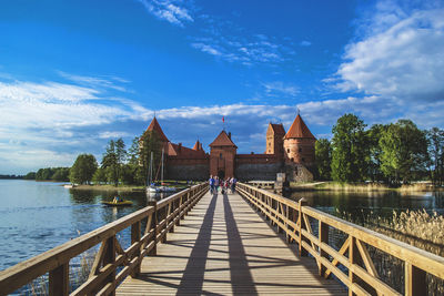 Bridge over lake against sky