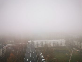 High angle view of city buildings against sky