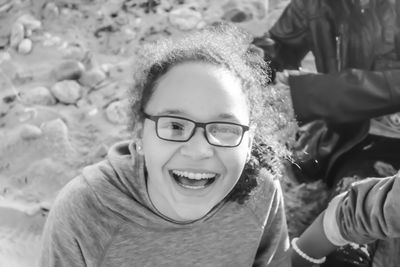 High angle portrait of smiling teenage girl wearing eyeglasses