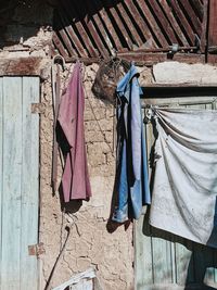 Clothes drying on clothesline against building