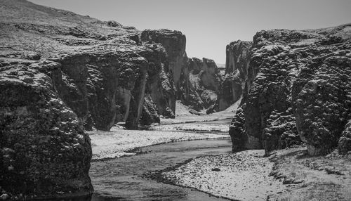 Panoramic shot of rocks against clear sky