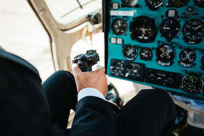 High angle view of pilot controlling helicopter