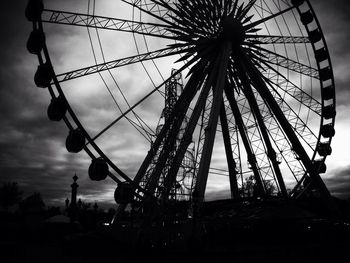 Low angle view of ferris wheel against sky