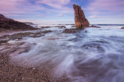 Scenic view of sea against cloudy sky