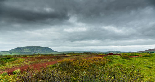 Scenic view of landscape against cloudy sky