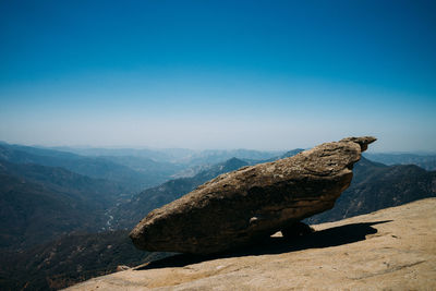 Scenic view of mountain against blue sky