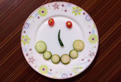 High angle view of fruits in plate on table