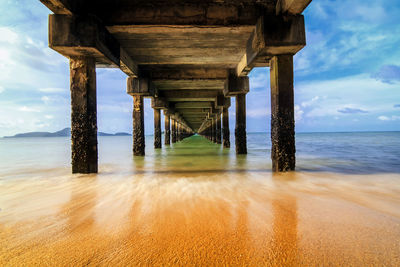 Scenic view of pier over sea against sky