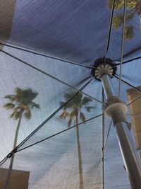 Low angle view of hanging water against sky