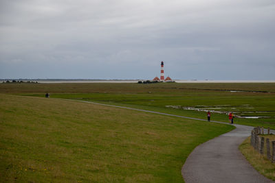 Scenic view of farm against sky